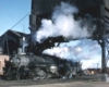 A train passing beneath a coal chute