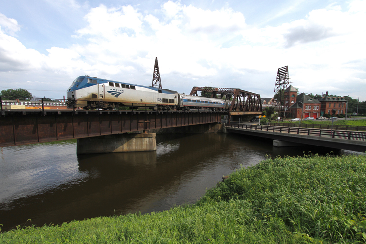 Amtrak train on bridge crossing river