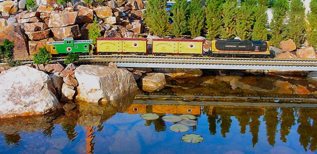 model train running over bridge