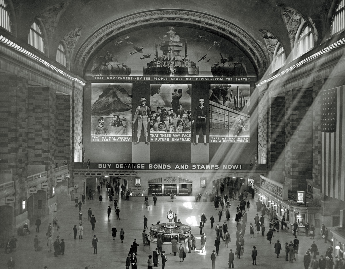 An overhead shot of people walking inside grand central station
