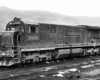 A clinchfield locomotive sitting on the tracks