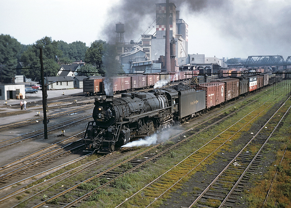 A train passing through a rail yard