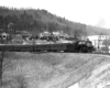 A black and white photo of Clinchfield 4-6-2 No. 154 turning a corner on the tracks