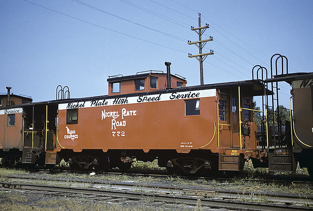 This former Wheeling & Lake Erie caboose, at Cleveland in July 1959, displays Nickel Plate’s “High Speed Service” slogan. 