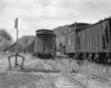 Two trains parked at a train station