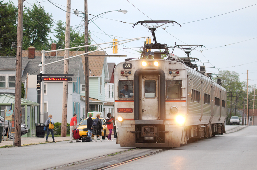 A South Shore Line train trundles through city streets in Michigan City, Ind.