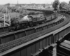 Steam-powered freight on sharp curved bridge