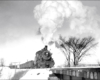 Steam locomotive with freight train in snow