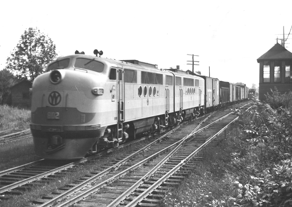 Two-unit diesel locomotive with freight train