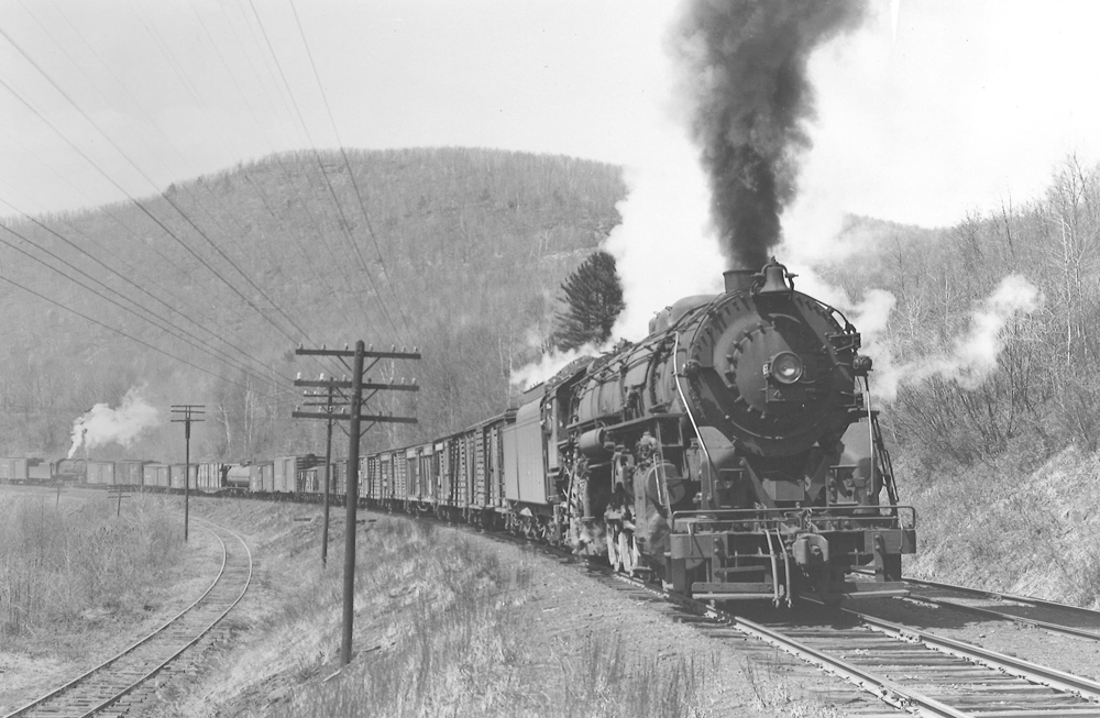 Steam locomotive with freight train on curve