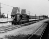 a passenger train by a station