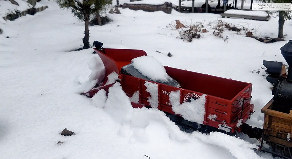 Class A Climax plowing snow on a garden railroad