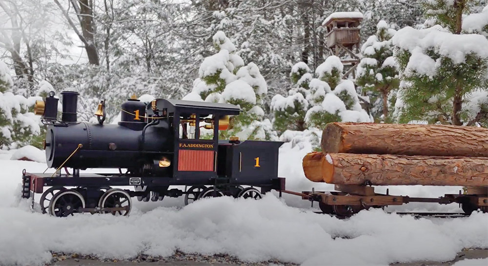 Heisler engine running on a snowy garden railroad