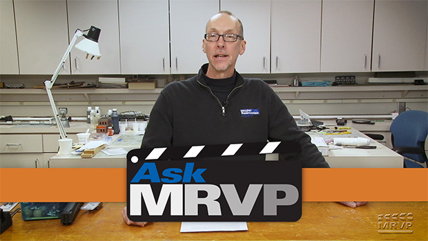 David stands at a counter in the Model Railroader workshop and introduces a video.