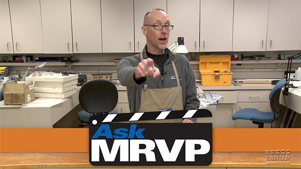 David Popp stands behind a counter in the Model Railroader workshop and introduces a video.