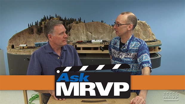 David Popp and co-host Charlie Conway have a conversation while standing in front of the N scale Canadian Canyons layout.