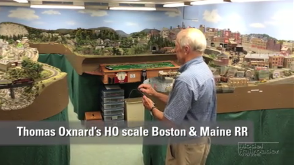 a man operating a model railraod