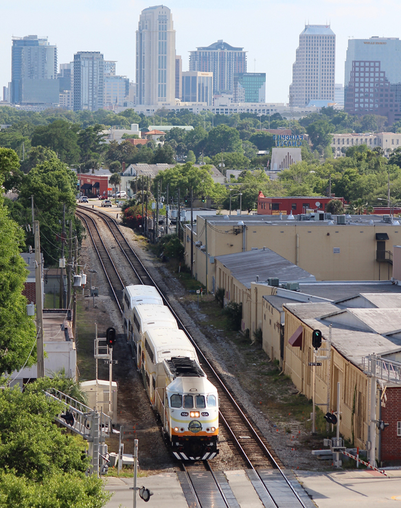 SunRail train with city skyline in background