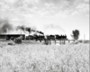 Two steam locomotives on wooden trestle