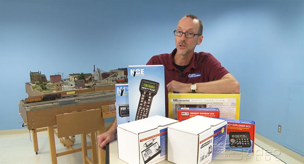 David Popp standing behind model railroad products
