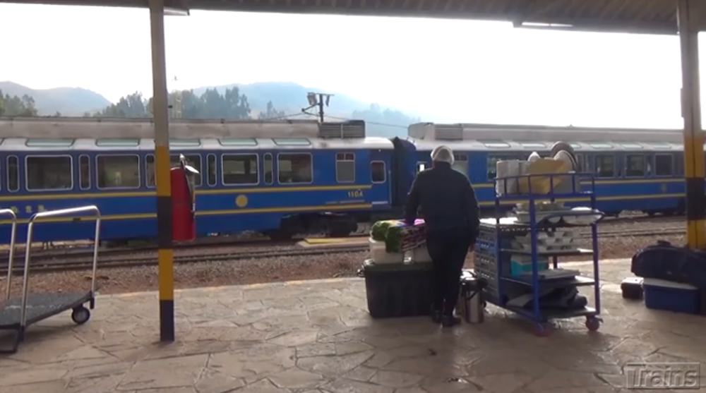 A PeruRail EMD GR12 brings a train into the station.