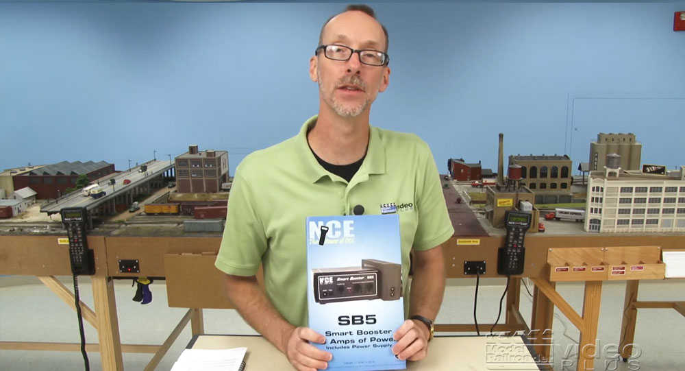David Popp holding an NCE Smart Booster