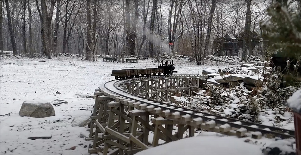 steam engine on a snowy garden railroad