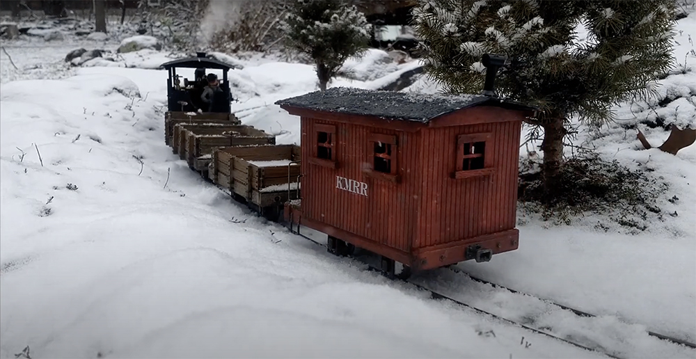 train on a snowy garden railroad