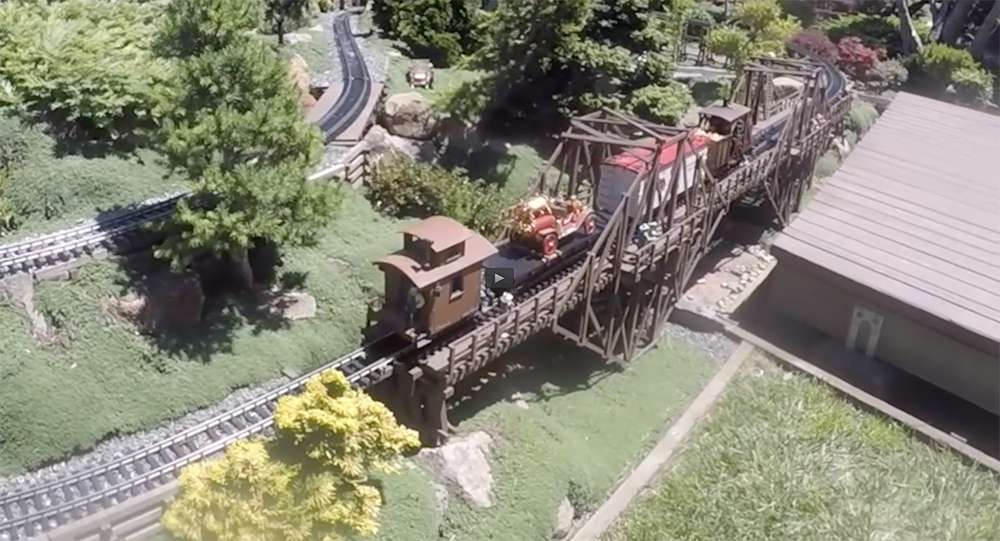 a model train running on a garden railroad