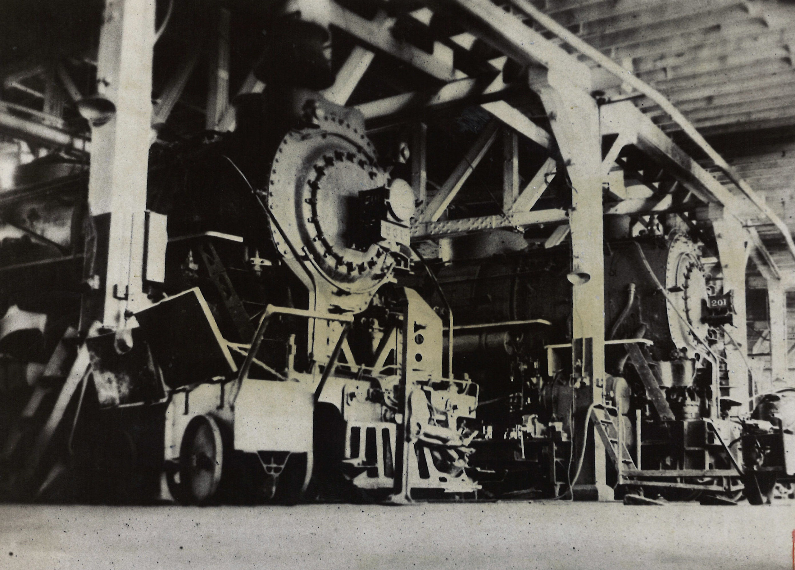 Two Toronto, Hamilton & Buffalo steam locomotives inside roundhouse