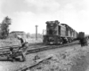 Worker throwing switch for freight train