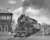 Lehigh & Hudson River steam locomotive passing tower with freight train