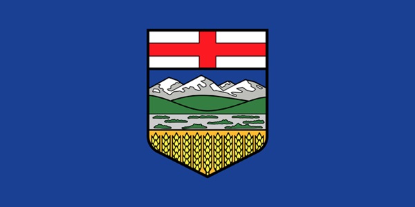 Blue flag with centered crest showing mountains and wheat
