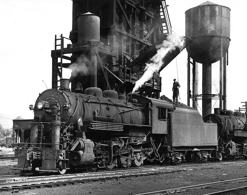 2-8-0 steam locomotive at coal and water facilities