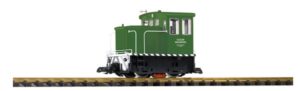 Green locomotive on tracks