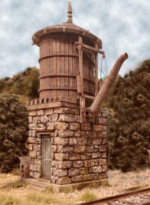 Water tower next to tracks