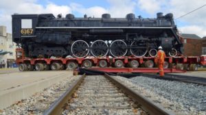 locomotive being moved over tracks