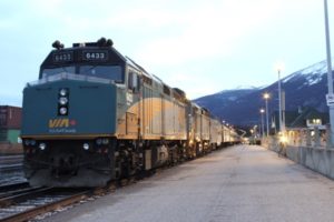 A train pulled up beside a platform