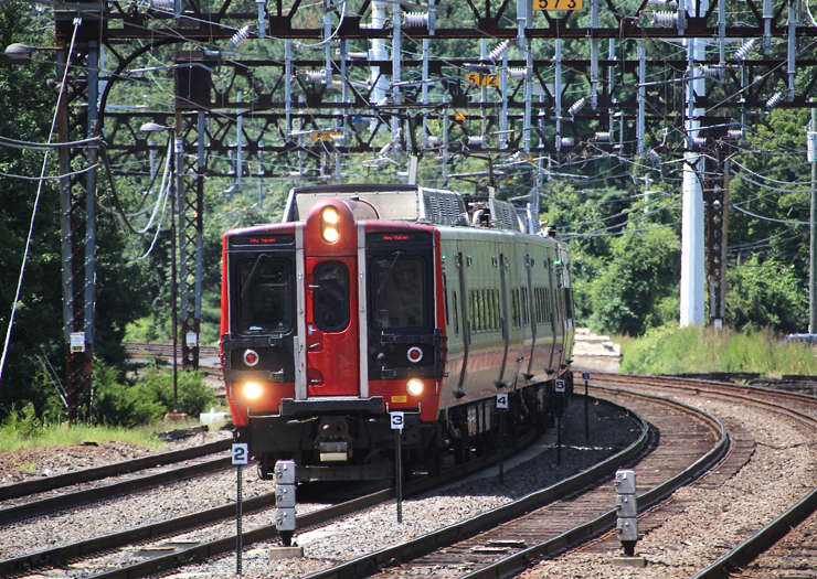 A Metro-North train heads north through Westport, Conn