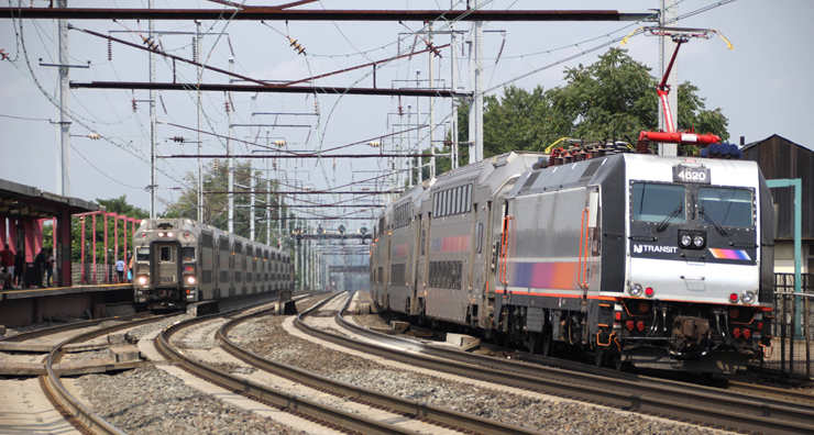 Two commuter trains at station on four-track main line