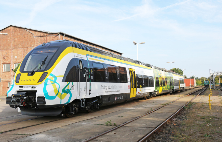 A white and yellow-painted passenger train.