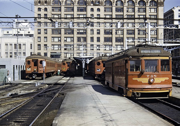 Several interurban cars at a passenger terminal.