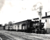 Ann Arbor 4-6-0 steam locomotive with passenger train .