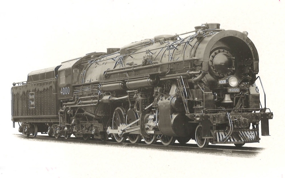 2-8-4 steam locomotive as seen obliquely from the front.