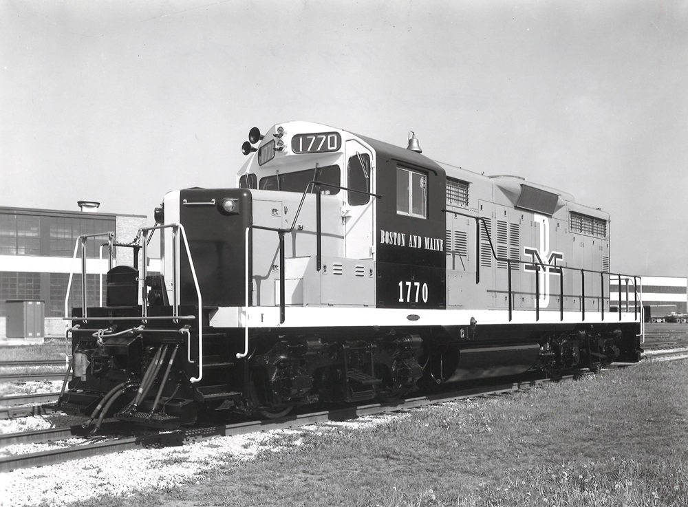 An oblique front view of a mid-century diesel locomotive.