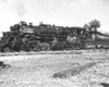An articulated steam locomotive in a rail yard.