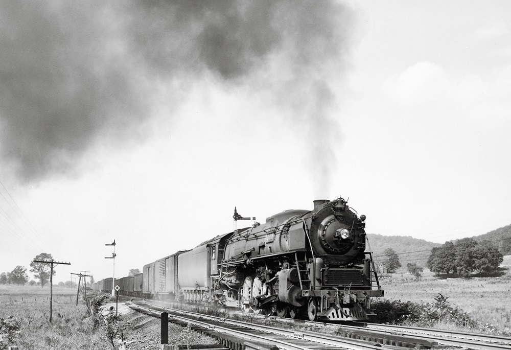 Lehigh & Hudson River steam locomotive with freight train.