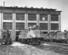 Lehigh & Hudson River diesel locomotives outside shop building.