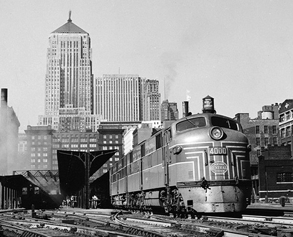 Streamlined diesel locomotives at passenger terminal.