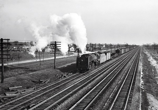 Steam locomotive with freight train.